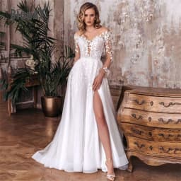 Elegantní svatební šaty do A-Line s otevřenými zády, výstřihem do V, krajkou a dlouhým rukávem s bočním rozparkem, tylem a svatebními šaty... - náhled 2